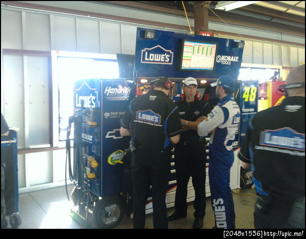 JJ, Chad and engineer Greg Ives debrief after the first practice